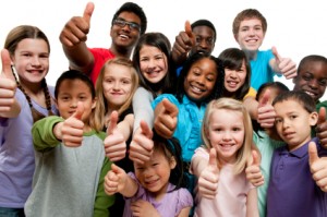 Group of young children giving the thumbs up