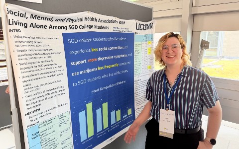 Angel Reed presenting research poster at SRCD Conference 2026